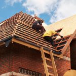 Roofing Contractors Installing House Roof Board